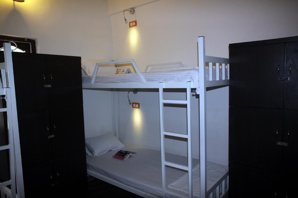 Wanderers Hostel Morjim Quarto foto